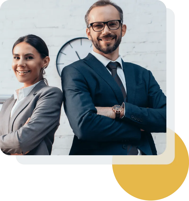 Two attorneys standing confidently in their office